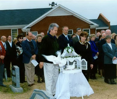 White doves released at a graveside service